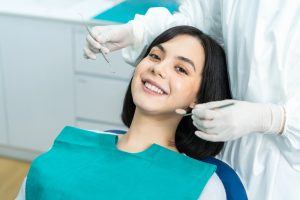 patient smiling in dental chair